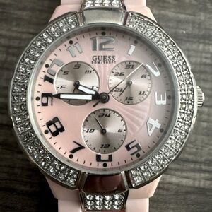 Guess Pink band and face with white crystals steel watch.
